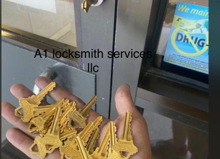 Residential Locksmith holds multiple keys in hand front of a door, representing the concept of key duplication and access service in Riverview.